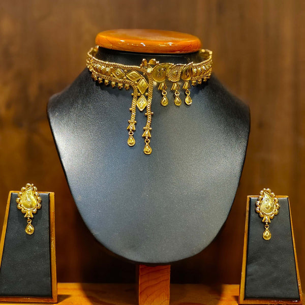 Gold plated choker set with matching earrings, featuring elegant design and intricate detailing for a stylish look.