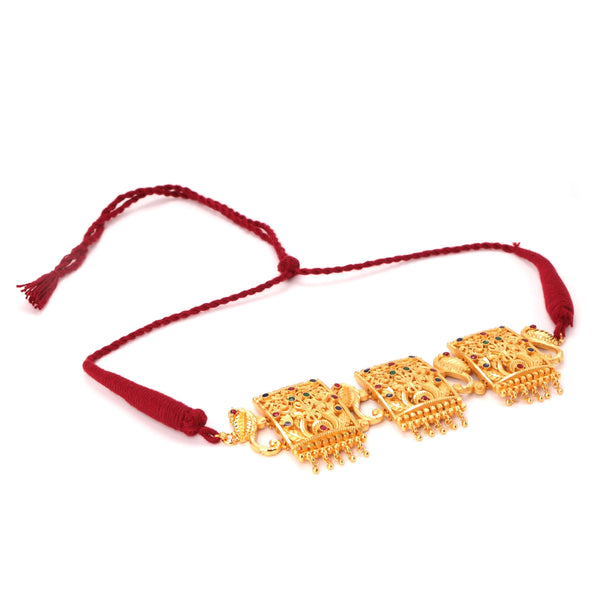 Intricate gold plated choker design with traditional motifs and red thread, perfect for festive occasions.