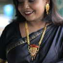 Model wearing Mahira Minakari Jaal Work Long Sitahar Set, gold plated Bengali bridal jewelry with matching earrings.