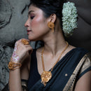 Model showcasing Kristi - Pasha Motif Slick Sitahar Set, featuring 24K gold plated earrings and necklace, traditional Bengali style.