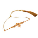 Elegant Palki choker set with intricate design in 24K gold-plated copper and matching tassel detail.
