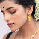 Elegant Bengali woman wearing traditional gold plated earrings, showcasing a beautiful design.