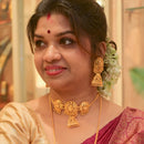 Elegant woman wearing gold-plated choker necklace and matching earrings, showcasing intricate design and traditional styling.