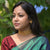 Beautiful woman wearing a gold plated floral choker necklace and matching earrings, showcasing elegant jewelry design.
