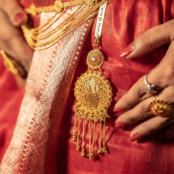 Jaal decorated Komor Jhapta, 24K gold plated copper jewelry showcasing intricate design and hanging tassels.