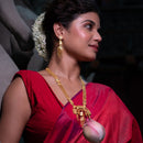 Model showcases Ranjita Sitahar Set in 24K gold plated copper, wearing traditional Bengali jewelry with a red sari.