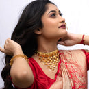 Woman wearing a Sabeki Jhalor choker necklace, styled with traditional attire and gold-plated jewelry.